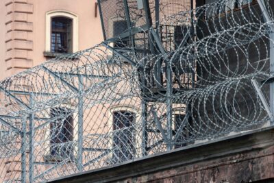 a metal fence with a metal gate